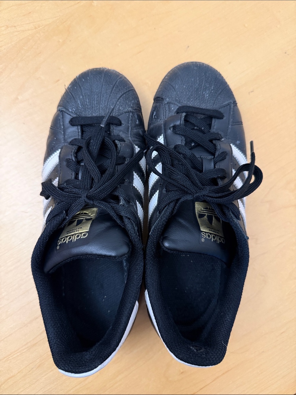 adidas Black Sneakers with White Stripes and Gold Tongue Logo